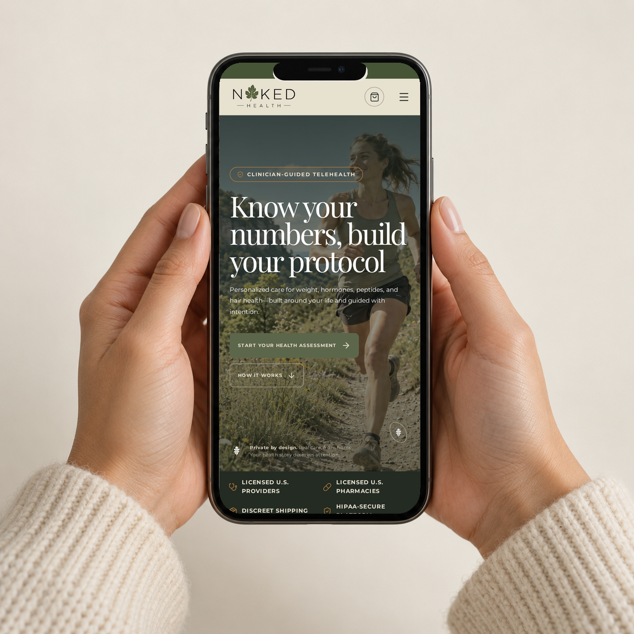 Hands holding a phone showing the Naked Health website.